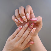 3D floral press-on nails in romantic pink with gradient and metallic accents