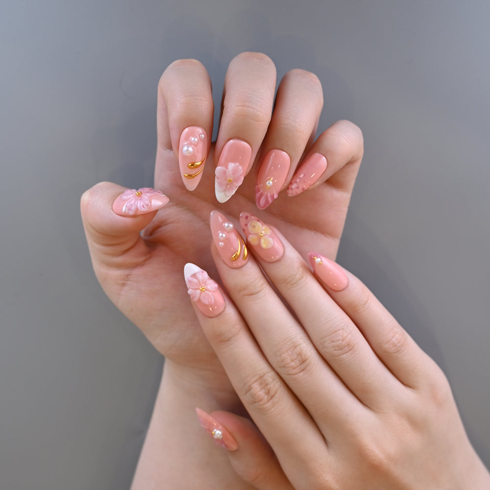 Romantic blush nude press-on nails with spring flowers and delicate pearls