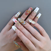 Luxury handmade nails with religious art, pearls, and 3D floral details