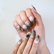 Gothic style press-on nails with smoky gradient, silver veins, and crystal details