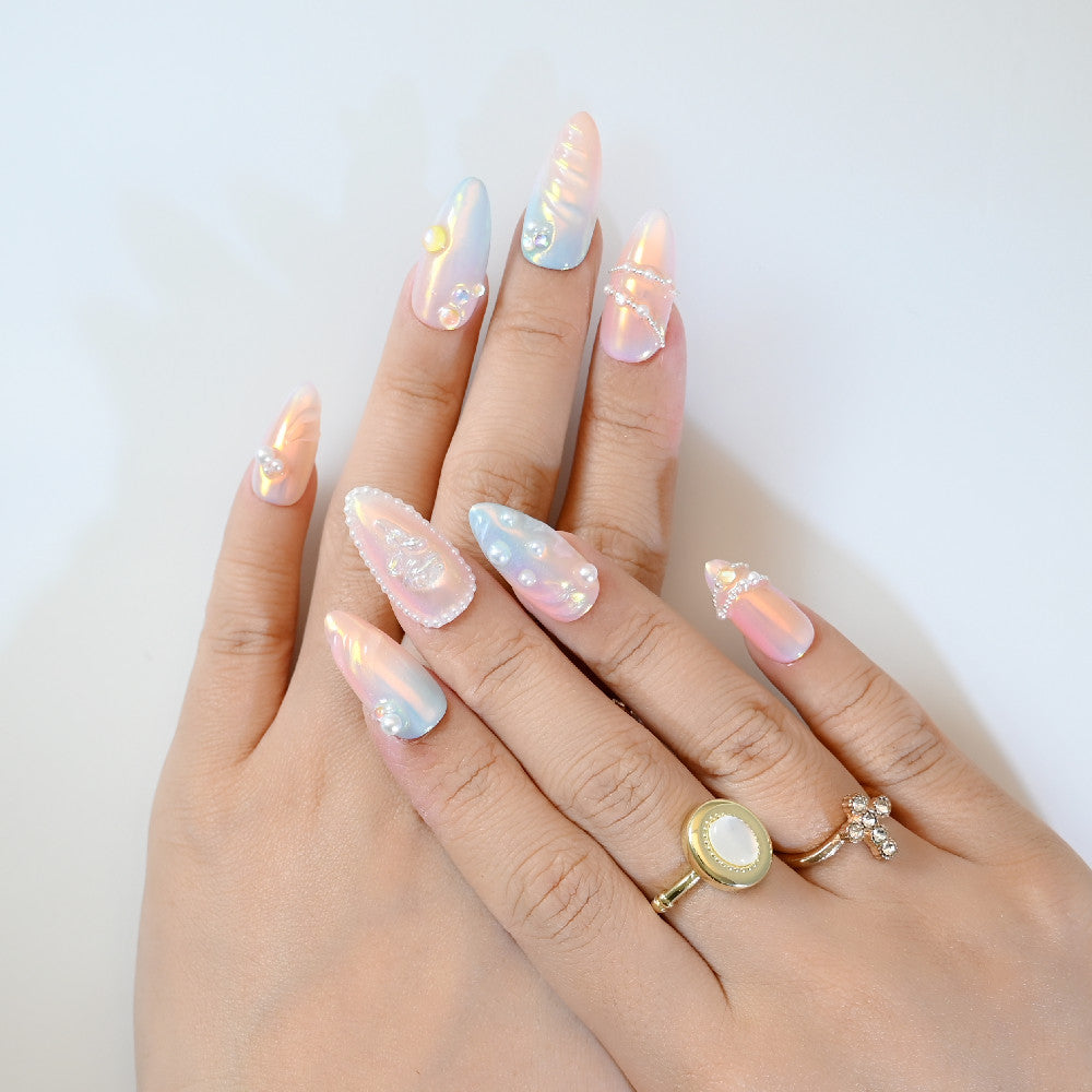 Holographic press-on nails with 3D rose carving, pearl borders, and opal-like shine