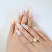 Holographic press-on nails with 3D rose carving, pearl borders, and opal-like shine