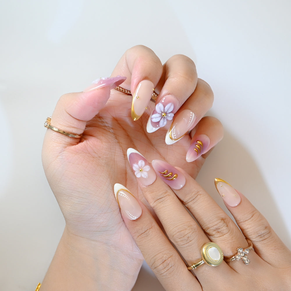 Romantic pink gradient press-on nails with white flowers and delicate gold lining