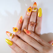 Summer floral press-on nails with realistic sunflower art, bee accents, and gradient nail polish"