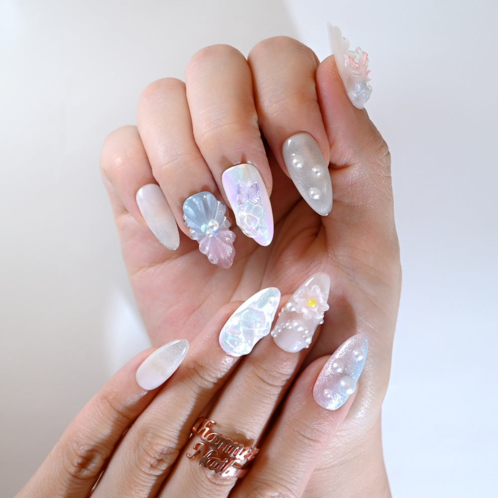 Holographic mermaid press-on nails with purple butterfly charm and seashell design