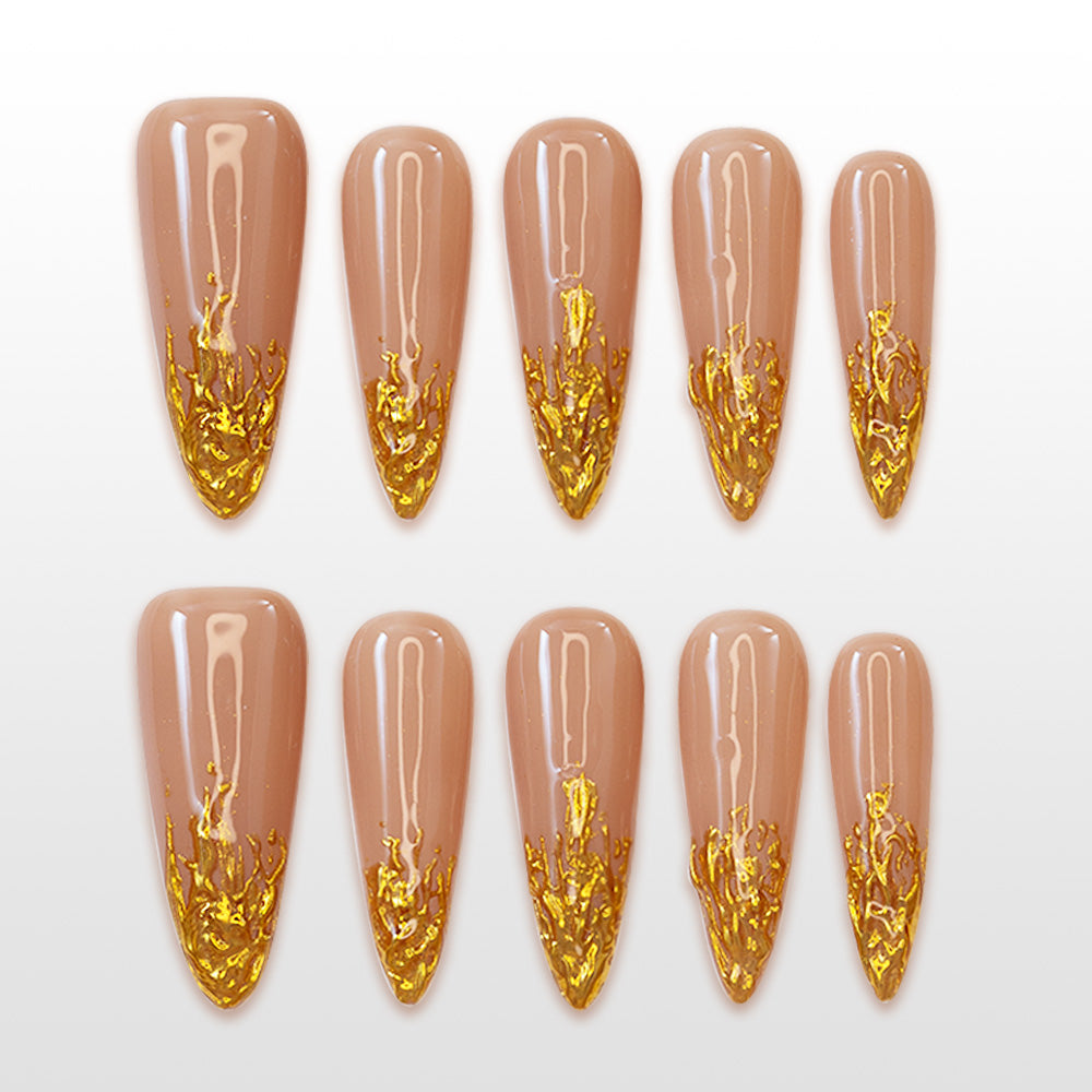 Elegant handmade nude brown nails featuring metallic gold abstract tip design