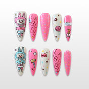 Long stiletto press-on nails with cute cartoon bunny character and colorful confetti design