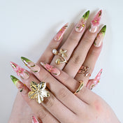 Luxury pink and green press-on nails with 3D blossom and gold details