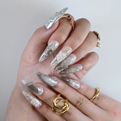 Handmade silver and nude ombre nails featuring embossed metal designs