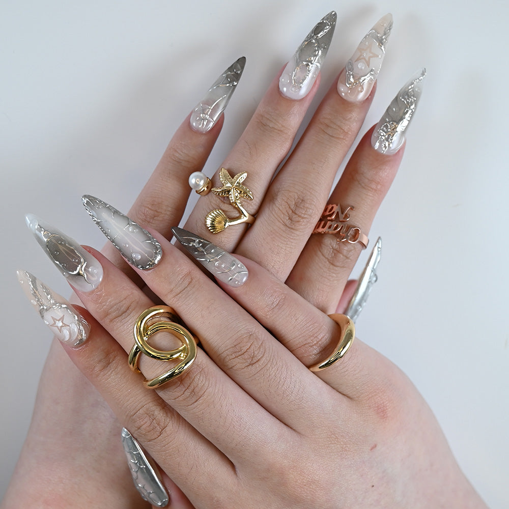 Luxury stiletto metallic nails with futuristic silver chrome accents