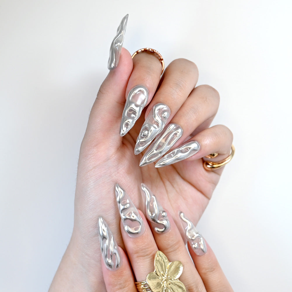 Handmade metallic nails with futuristic molten silver design