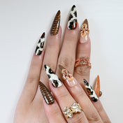 Reusable press-on nails with bold animal print and artistic flower details