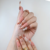 Reusable press-on nails with leopard spots, rhinestones, and floral design