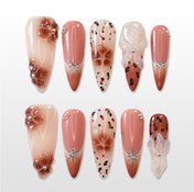 Brown gradient press-on nails with leopard print and silver star accents