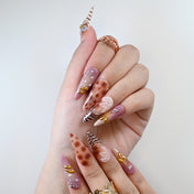 Reusable press-on nails with marble pattern, purple tones, and floral art