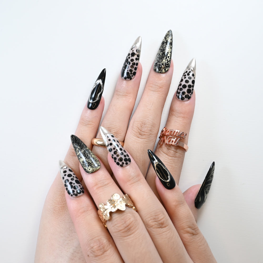 Reusable stiletto nails with gold shimmer and black lace details