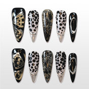 Black and gold butterfly press-on nails with metallic silver tips