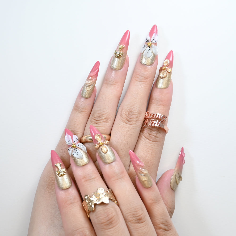Reusable long stiletto nails with elegant pink and gold ombre finish