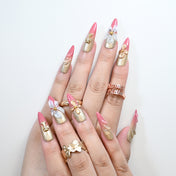 Reusable long stiletto nails with elegant pink and gold ombre finish