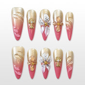 Gold and pink gradient press-on nails with 3D white lily flower design