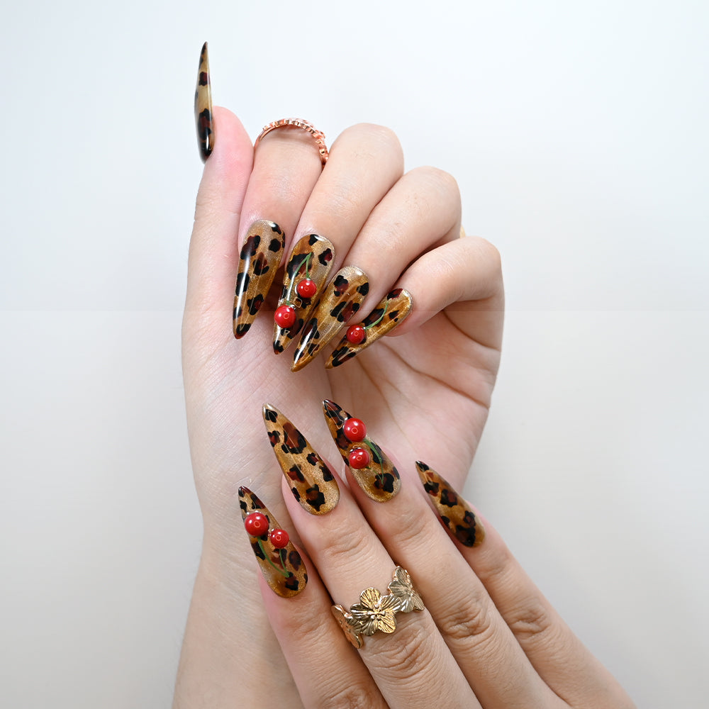 Reusable press-on nails with glitter gold base and cherry fruit charm