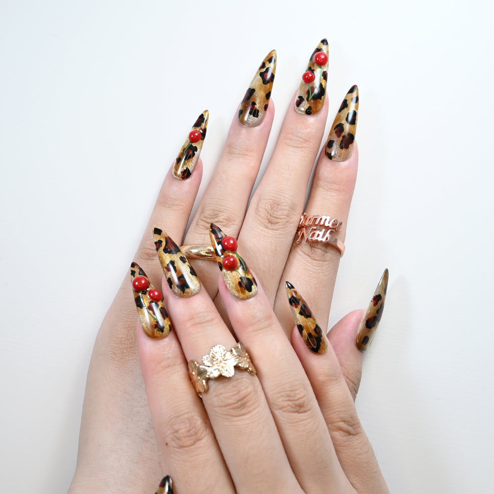 Sexy press-on nails with leopard pattern and playful cherry details