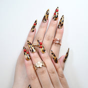Sexy press-on nails with leopard pattern and playful cherry details
