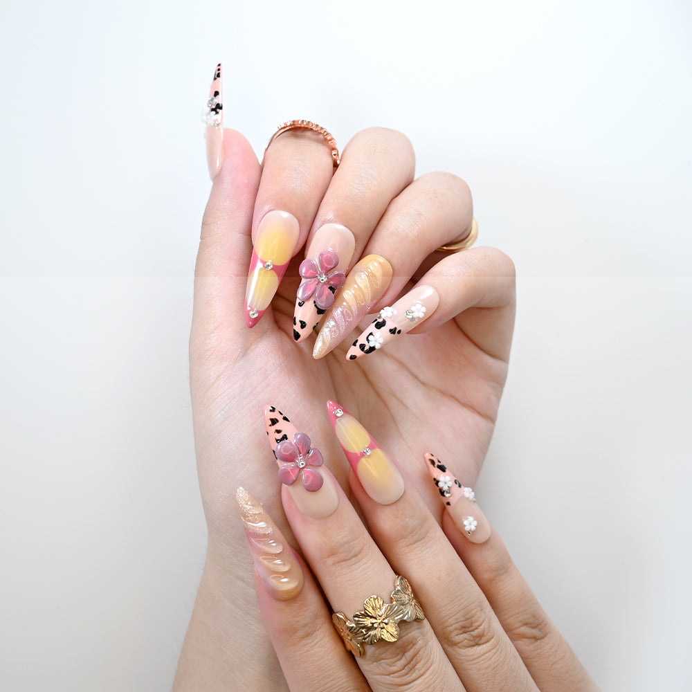 Handmade long nails with animal print, gradient shimmer, and floral accents