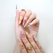 Handmade long nails with animal print, gradient shimmer, and floral accents