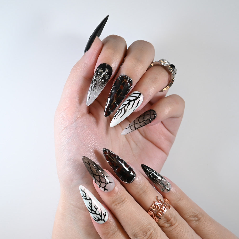 Long stiletto reusable press-on nails with gothic cross and spooky spiderweb art