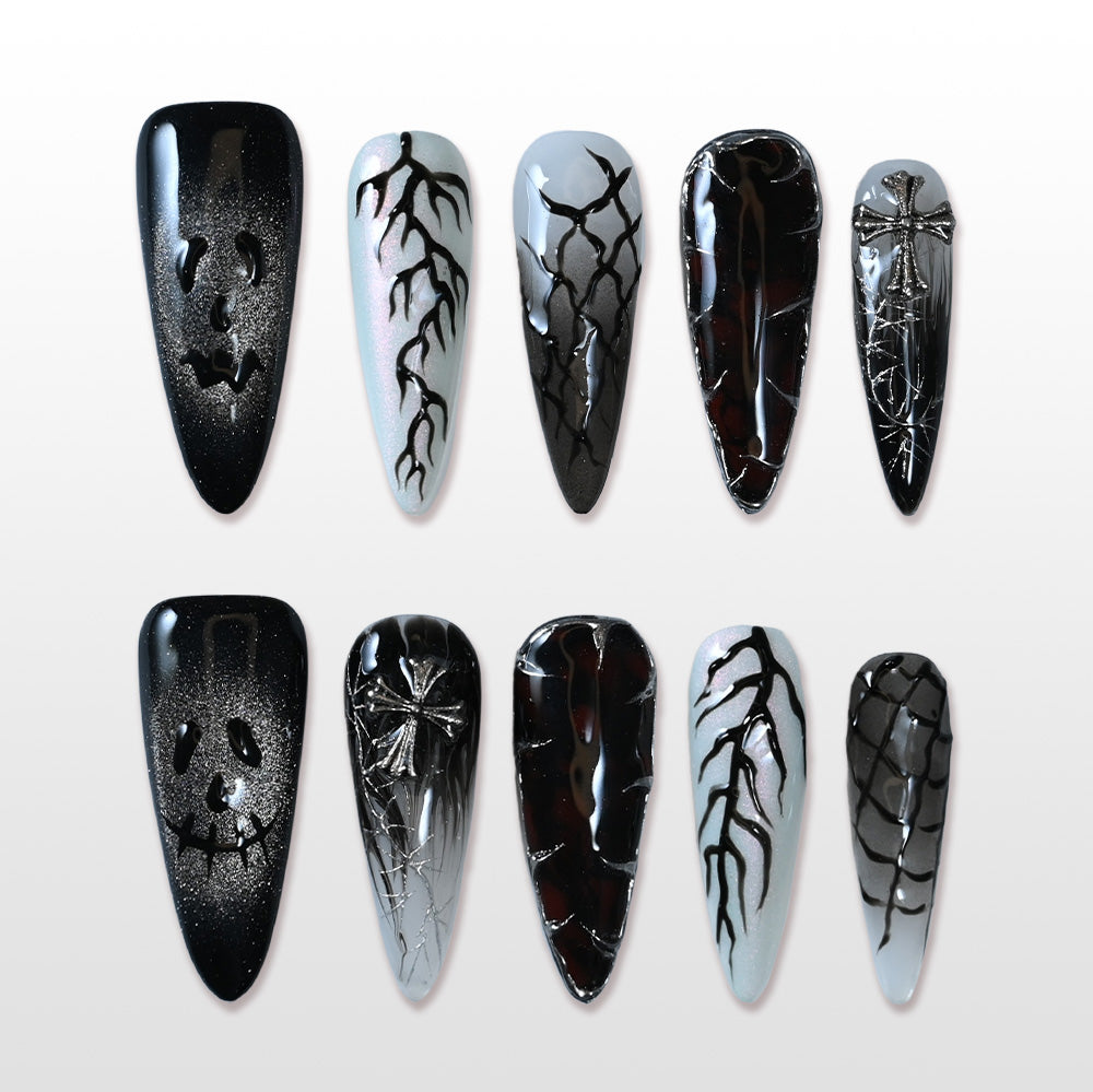 Handmade black Halloween press on nails with pumpkin ghost face and cracked design