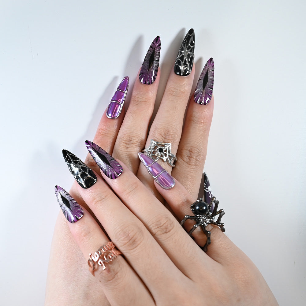 Long stiletto reusable press-on nails with gothic purple shimmer and web art