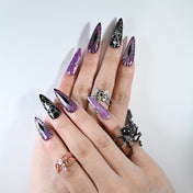 Long stiletto reusable press-on nails with gothic purple shimmer and web art