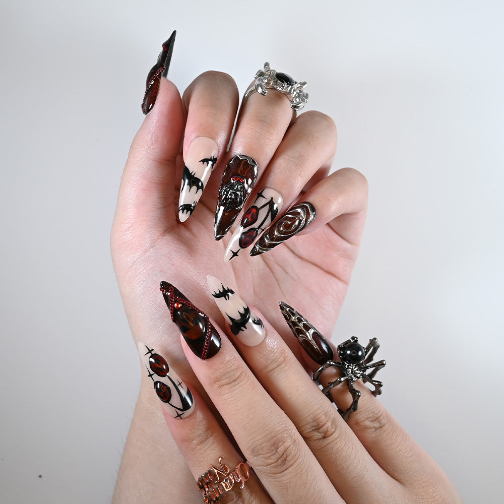 Long stiletto reusable press-on nails with vampire bats, stitched details and creepy red eyes