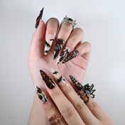 Long stiletto reusable press-on nails with vampire bats, stitched details and creepy red eyes