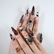 Charmeenail acrylic nails in dark horror style with spider web, blood splatter and chain accents