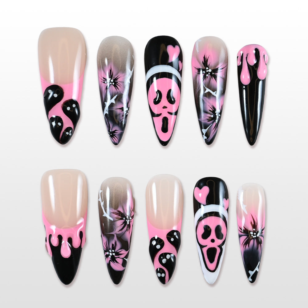 Handmade pink and black press on nails with ghost faces, scream mask and spooky flower art