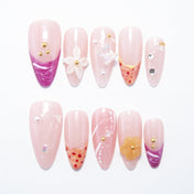 Pink press-on nails with purple tips, 3D flowers, and butterfly charm accents