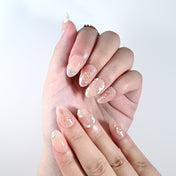 Handmade short almond nails with glitter, rhinestones, and floral details