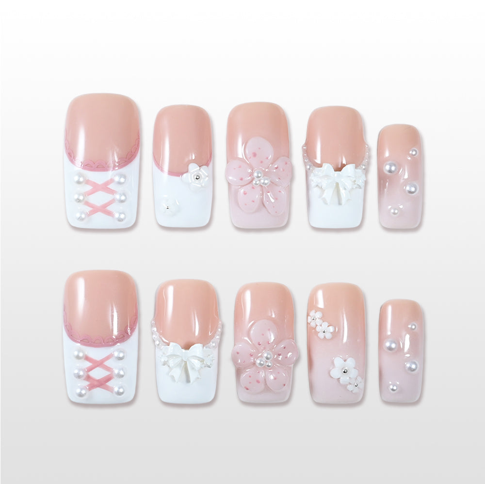 Square press-on nails with 3D bow, pearls, and blush pink base