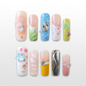 Colorful press-on nails with pastel flowers, pearls, and gemstone accents