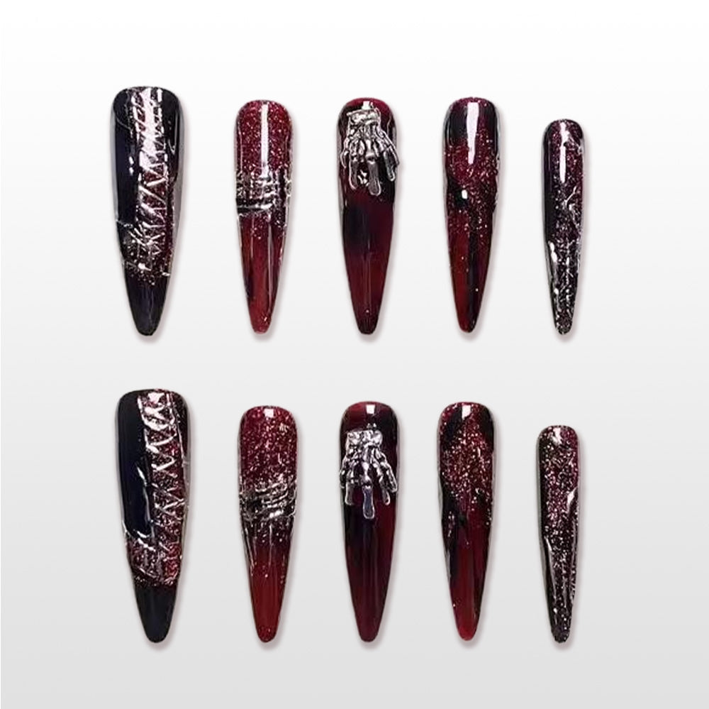 Handmade red and black stiletto press on nails with glitter gradient and 3D gothic accents