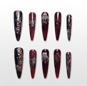 Handmade red and black stiletto press on nails with glitter gradient and 3D gothic accents