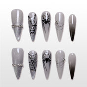 Handmade grey stiletto press on nails with black spider and web design