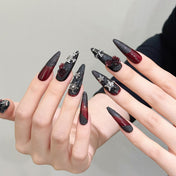 Long stiletto reusable press-on nails featuring dark roses, pentagram stars and silver cross accents