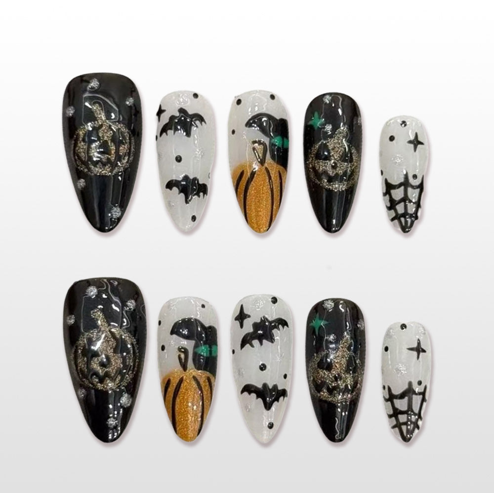 Handmade black and white Halloween press on nails with pumpkin, bat and spiderweb design