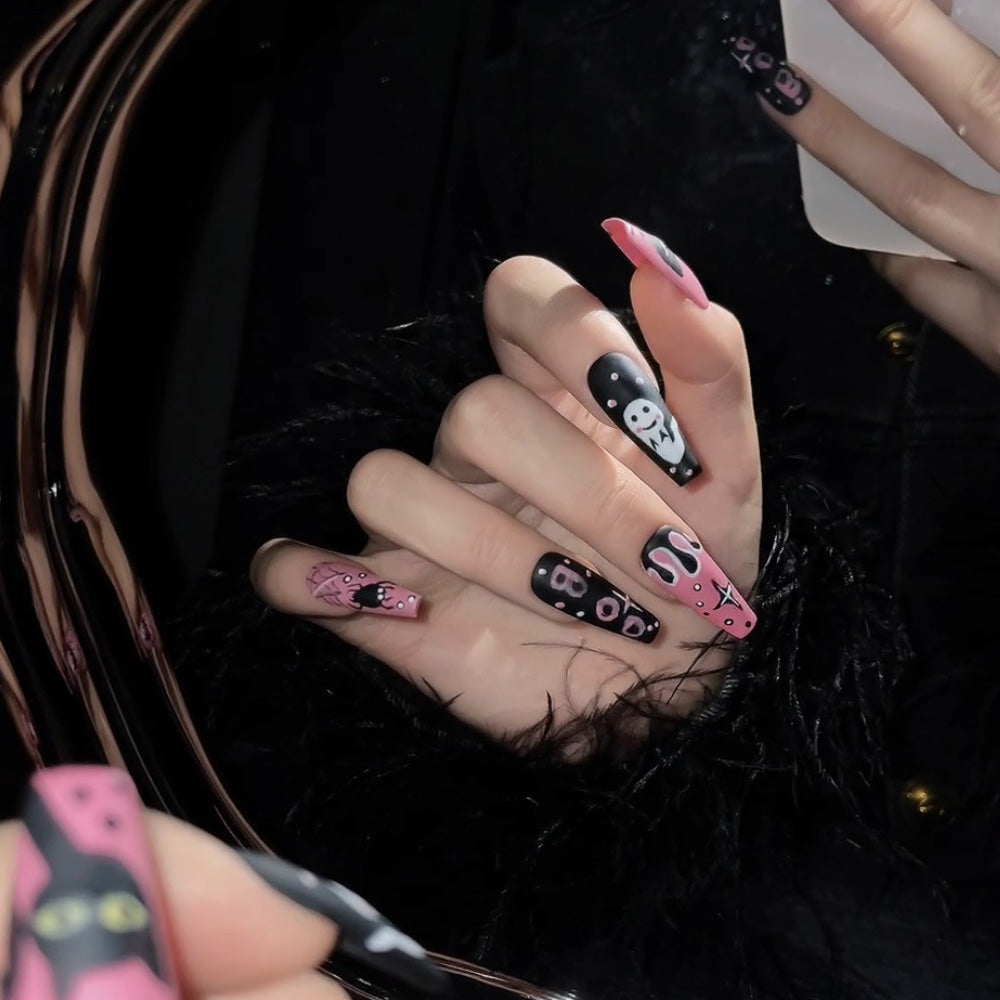 Long coffin acrylic nails featuring cute ghost, creepy spiderwebs and Halloween letters