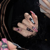 Long coffin acrylic nails featuring cute ghost, creepy spiderwebs and Halloween letters