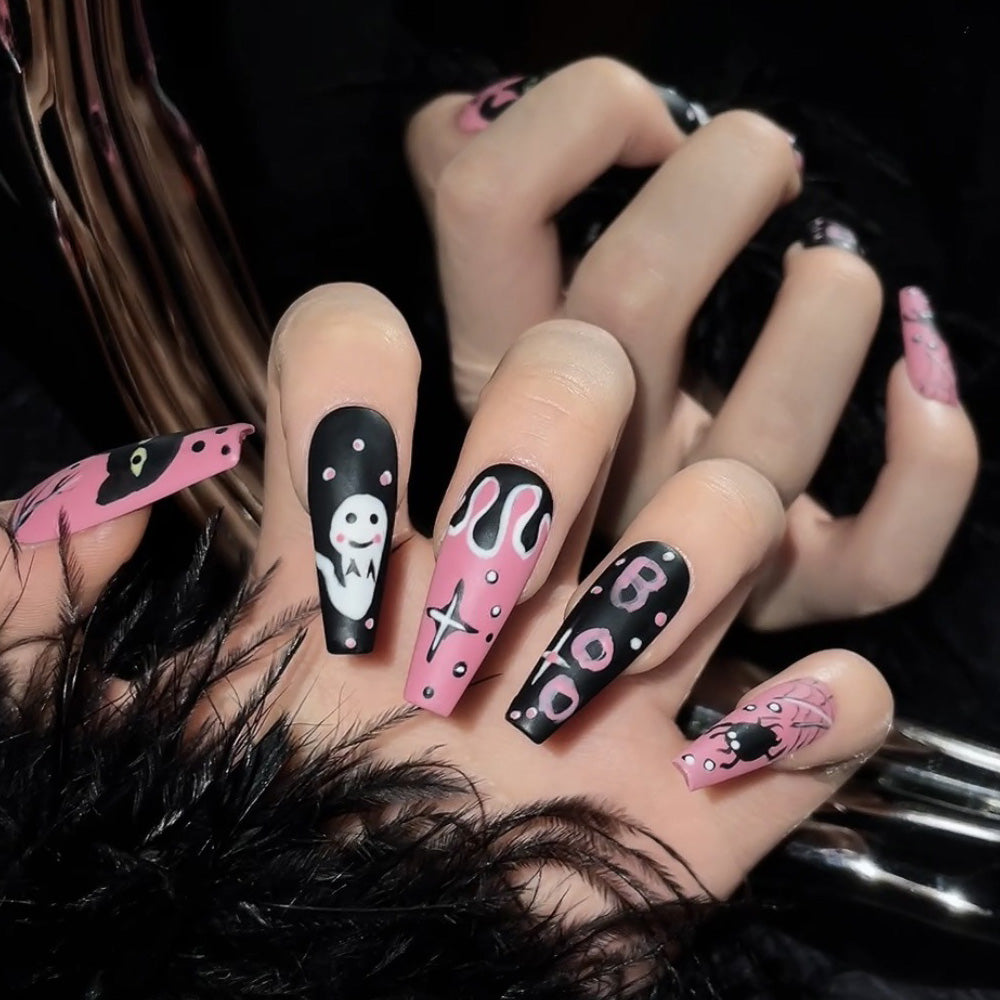 Charmeenail reusable press-on nails in pink and black with cartoon ghost and spooky spider art