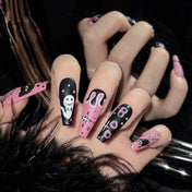 Charmeenail reusable press-on nails in pink and black with cartoon ghost and spooky spider art